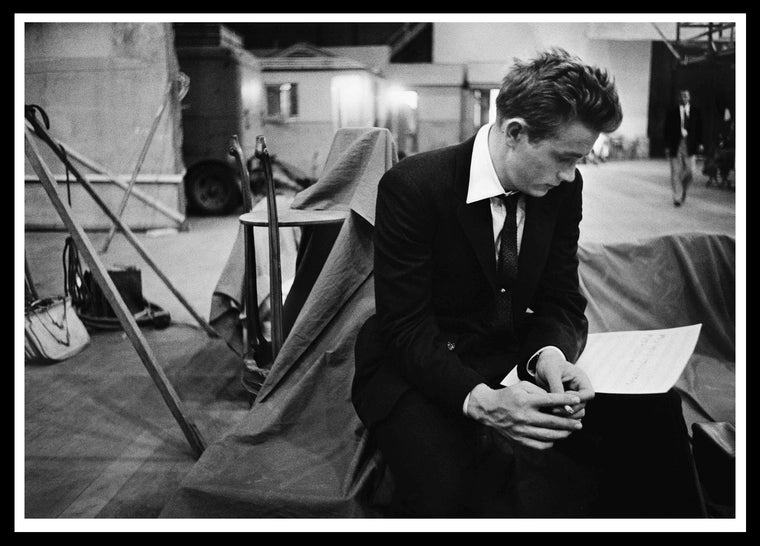 James Dean reading on the set of 'Rebel Without A Cause 1955 Framed Print 28 x 38